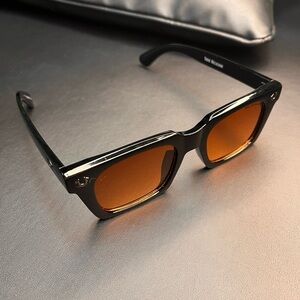 Stylish Black True Religion Sunglasses with Orange Lenses